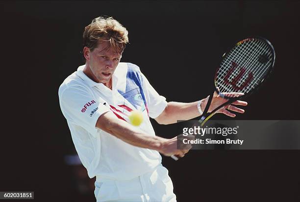 Stefan Edberg of Sweden makes a backhand return to Robbie Weiss during a Men's Singles third round match at the ATP Lipton Tennis Championship on 11...