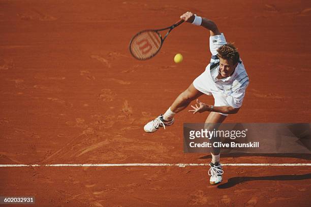 Stefan Edberg of Sweden against Michael Chang during their Men's Singles match at the French Open Tennis Championship on 1 June 1996 at the Stade...
