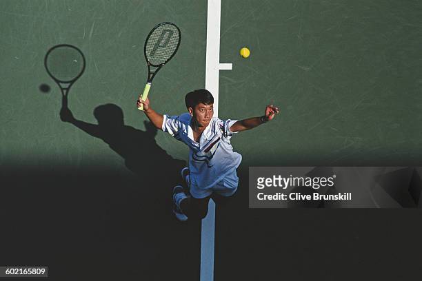 Michael Chang of the United States serves to Andre Agassi during the Men's Singles fourth round match of the United States Open Tennis Championship...