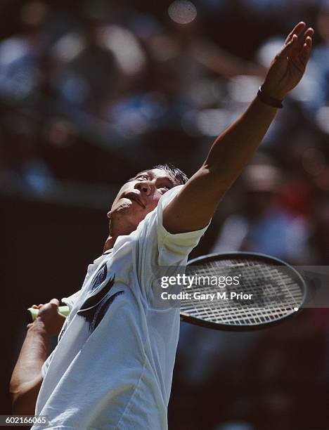 Michael Chang of the United States serves to Sergi Bruguera of Spain during their Men's Singles fourth round at the Wimbledon Lawn Tennis...