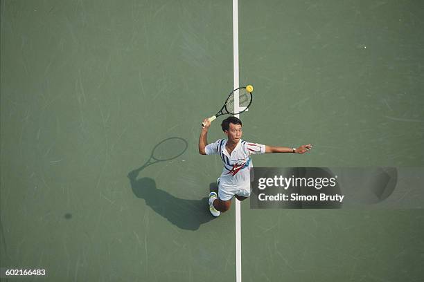 Michael Chang of the United States serves to Wayne Ferreira during the Men's Singles Quarter Final match of the United States Open Tennis...
