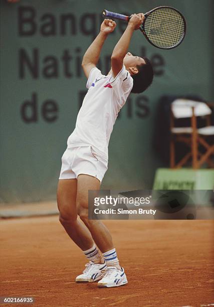 Michael Chang of the United States celebrates after winning the Men's Singles Final against Stefan Edberg at the French Open Tennis Championship on...
