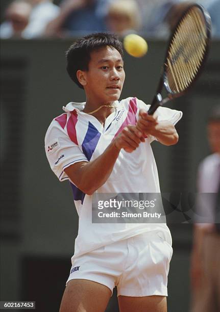 Michael Chang of the United States returns against Stefan Edberg during the Men's Singles Final at the French Open Tennis Championship on 11 June...