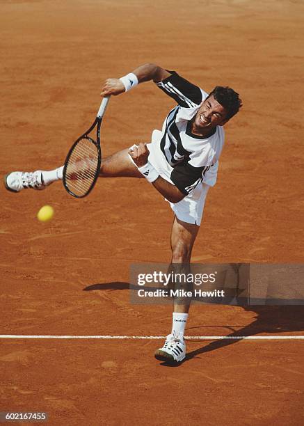 Sergi Bruguera of Spain serves against Gustavo Kuerten of Brazil during their Men's Singles Final match at the French Open Tennis Championship on 8...