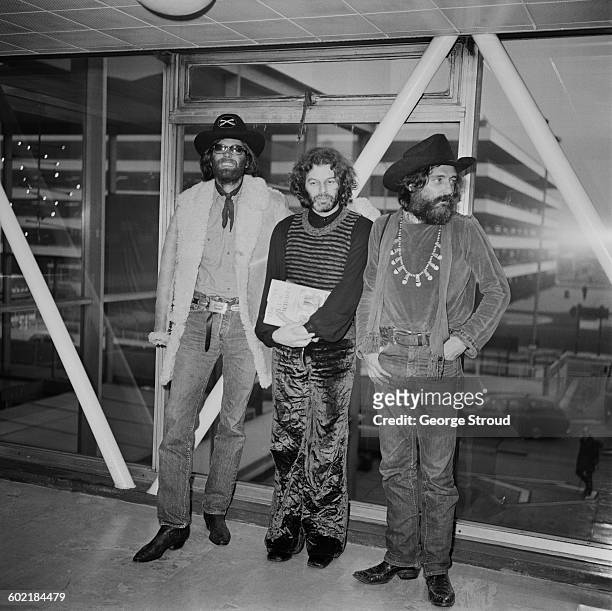 From left to right, actor Peter Fonda, Alejandro Jodorowsky and Dennis Hopper at London Airport, UK, 21st January 1971.