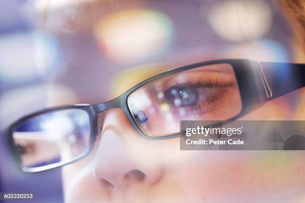 child, computer/table/phone reflections in glasses - human eye foto e immagini stock
