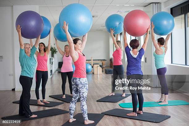 pilates class - fitness ball stock pictures, royalty-free photos & images