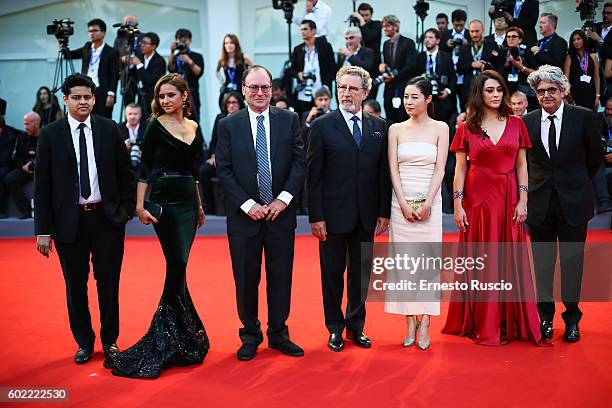 Jury members Chaitanya Tamhane, Moon So-ri, Nelly Karim, Jim Hoberman, Robert Guediguian, Valentina Lodovini and Jose Maria Chema Prado attend the...