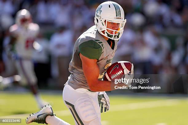 Blake Lynch of the Baylor Bears pulls in a touchdown pass against the Southern Methodist Mustangs in the third quarter at McLane Stadium on September...