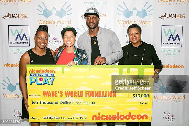 Tragil Wade, Manager of Public Affairs For Nickelodeon Sydney Cohn, Dwyane Wade, and Pastor Jolinda Wade attend Nickelodeon's Road To Worldwide Day...