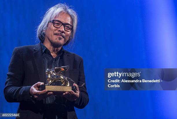 Director Lav Diaz poses with the Golden Lion for Best Film for 'The Woman who Left - Ang Babaeng Humayo' during the closing ceremony of the 73rd...