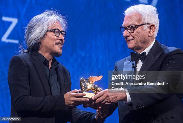 Director Lav Diaz receives the Golden Lion for Best Film for 'The Woman who Left - Ang Babaeng Humayo' during the closing ceremony of the 73rd Venice...