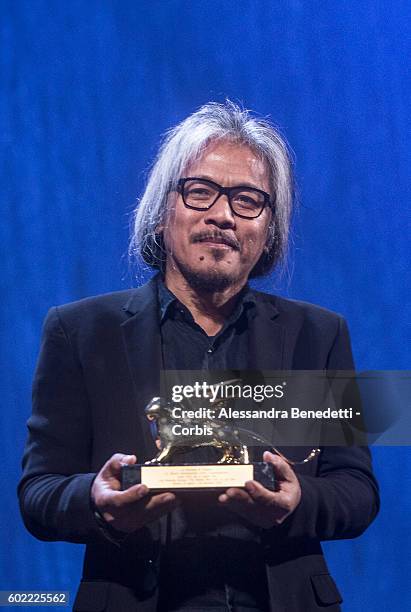 Director Lav Diaz poses with the Golden Lion for Best Film for 'The Woman who Left - Ang Babaeng Humayo' during the closing ceremony of the 73rd...