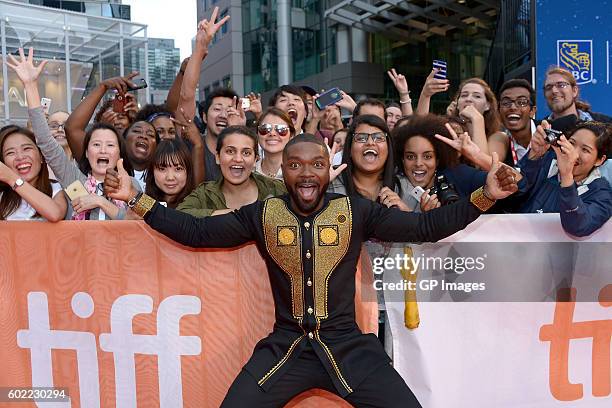 Actor David Oyelowo poses with fans at the "Queen of Katwe" premiere during the 2016 Toronto International Film Festival at Roy Thomson Hall on...