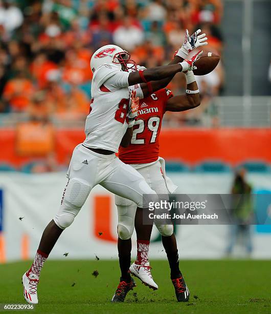 Corn Elder of the Miami Hurricanes break up the pass intended for John Mitchell of the Florida Atlantic Owls on September 10, 2016 at Hard Rock...