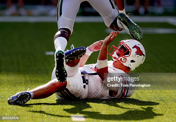 Ben Hicks of the Southern Methodist Mustangs gets knocked down against the Baylor Bears in the seconf half at McLane Stadium on September 10, 2016 in...