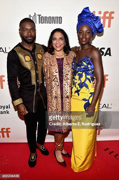 Actor David Oyelowo, director Mira Nair and actress Lupita Nyong'o arrive at the world premiere of Disneys Queen of Katwe at Roy Thompson Hall as...