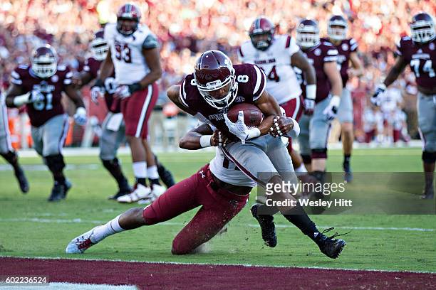 Fred Ross of the Mississippi State Bulldogs fights off a tackle and scores a touchdown during a game against the South Carolina Gamecocks at Davis...