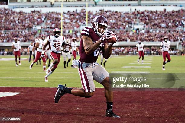 Donald Gray of the Mississippi State Bulldogs catches a pass for a touchdown in the first half during a game against the South Carolina Gamecocks at...