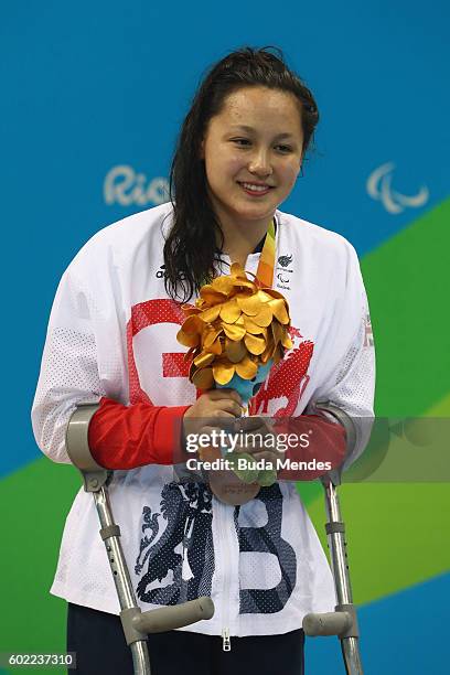 Bronze medalist Alice Tai of Great Britain poses on the podium at the medal ceremony for the Women's 100m Backstroke - S10 Final on day 3 of the Rio...