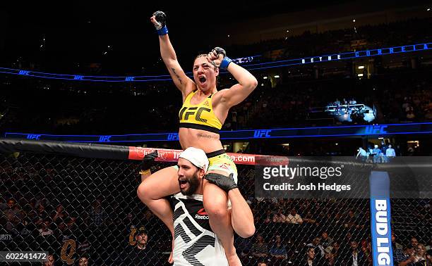 Bethe Correia of Brazil celebrates after defeating Jessica Eye in their women's bantamweight bout during the UFC 203 event at Quicken Loans Arena on...