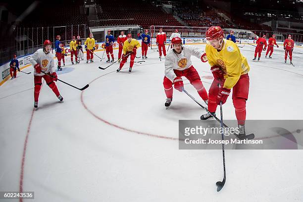 Nikolay Kulemin of Team Russia contest for the puck against Dmitry Kulikov of Team Russia during Team Russia training prior to World Cup Of Hockey...