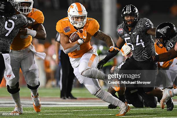 Running back Jalen Hurd of the Tennessee Volunteers carries the ball against the Virginia Tech Hokies in the first half at Bristol Motor Speedway on...