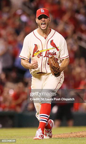 St. Louis Cardinals starting pitcher Adam Wainwright reacts after striking out the Milwaukee Brewers' Hernan Perez with the bases loaded to end the...