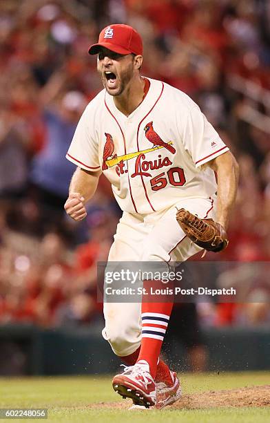 St. Louis Cardinals starting pitcher Adam Wainwright reacts after striking out the Milwaukee Brewers' Hernan Perez with the bases loaded to end the...