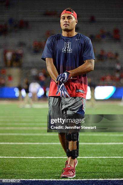 Quarterback Anu Solomon of the Arizona Wildcats walks on the field prior to the game against the Grambling State Tigers at Arizona Stadium on...