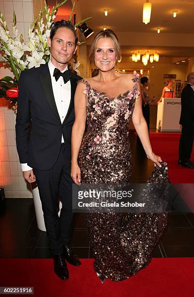 Designer Nick Lynch, designer of the dress and Kim Fisher during the Leipzig Opera Ball 'Let's dance Dutch' at alte Oper on September 10, 2016 in...