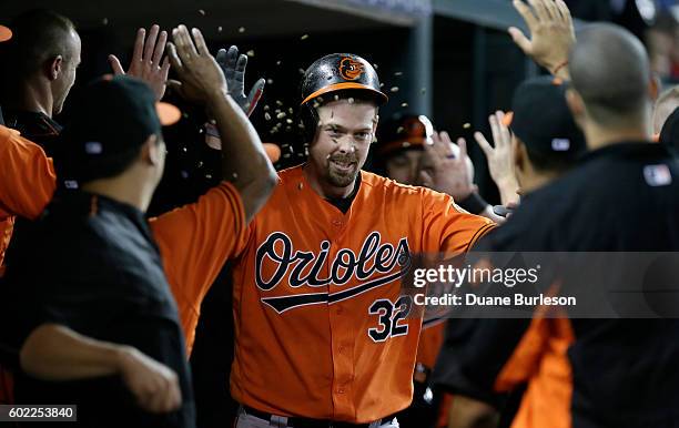 Matt Wieters of the Baltimore Orioles has seeds tossed at him while celebrating a three-run home run against the Detroit Tigers during the sixth...