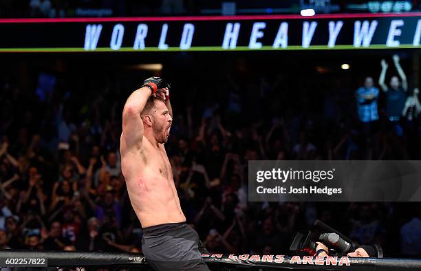Stipe Miocic celebrates after defeating Alistair Overeem of The Netherlands in their UFC heavyweight championship bout during the UFC 203 event at...