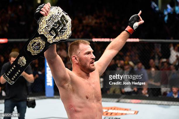Stipe Miocic celebrates after defeating Alistair Overeem of The Netherlands in their UFC heavyweight championship bout during the UFC 203 event at...