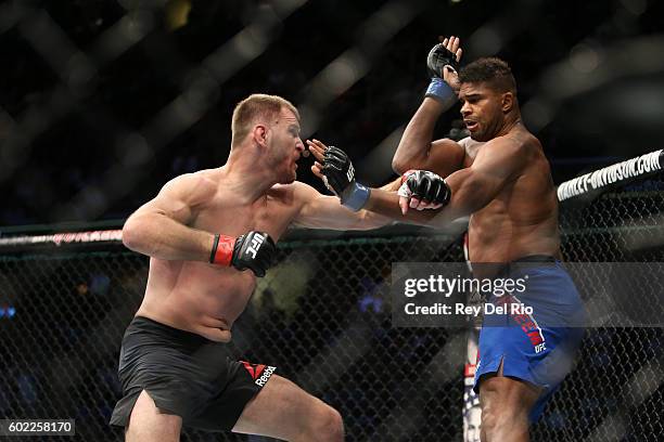 Stipe Miocic punches Alistair Overeem during the UFC 203 event at Quicken Loans Arena on September 10, 2016 in Cleveland, Ohio.