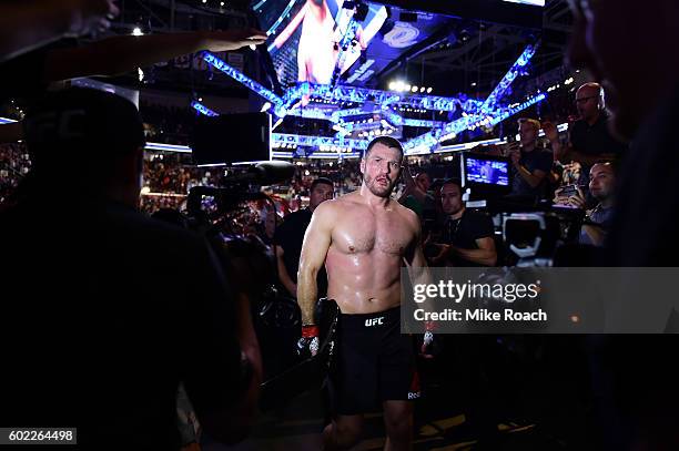 Heavyweight champion Stipe Miocic walks backstage after defeating Alistair Overeem of The Netherlands during the UFC 203 event at Quicken Loans Arena...