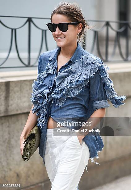 Guest is seen outside the Jonathan Simkhai show wearing a jeans top during New York Fashion Week Spring 2017 on September 10, 2016 in New York City.
