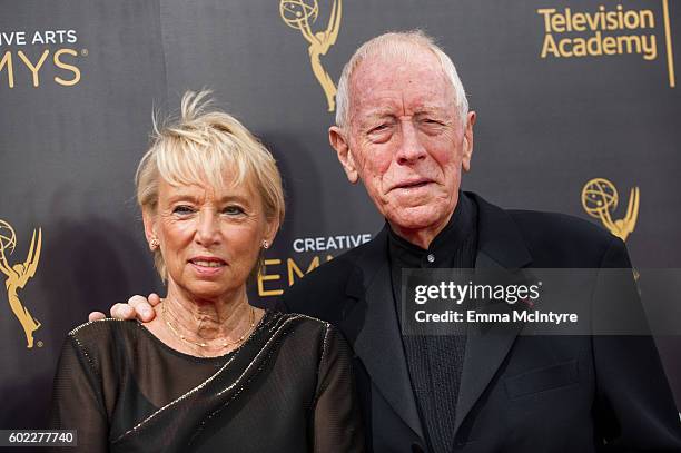 Catherine Brelet and Max von Sydow arrive at the Creative Arts Emmy Awards at Microsoft Theater on September 10, 2016 in Los Angeles, California.