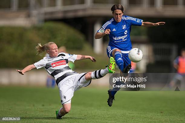 Jule Dallmann of VfL Borussia Moenchengladbach is challenged by Anne van Bonn of SC Sand during the match of Allianz Frauen Bundesliga on September...