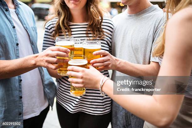 group of friends toasting with drinks for the beer fest - oktoberfest home stock pictures, royalty-free photos & images