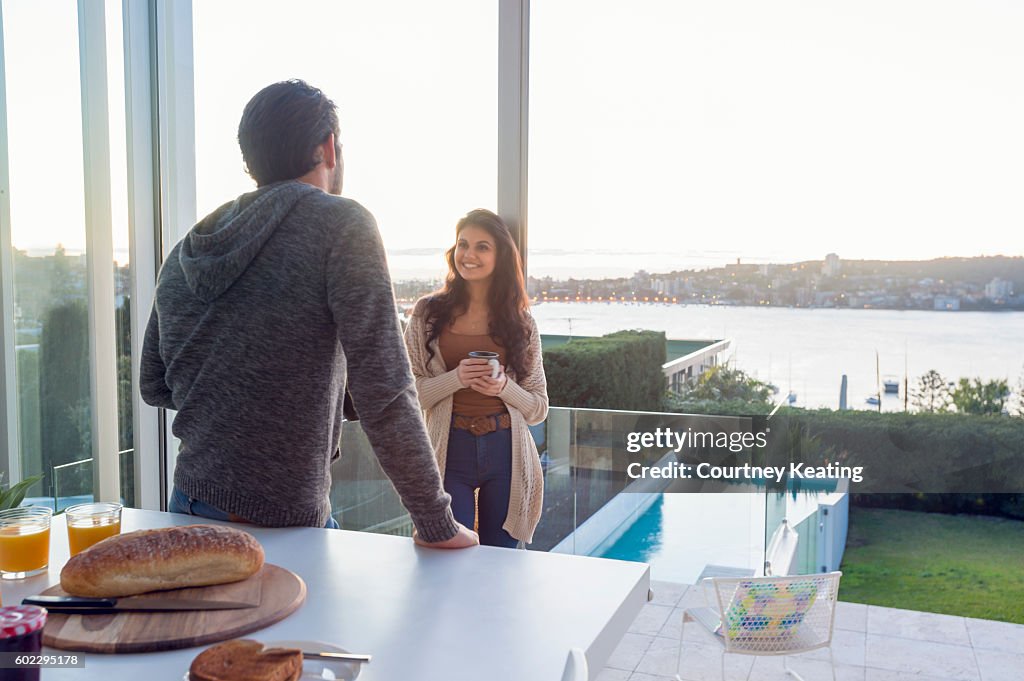 Couple having breakfast together at home.