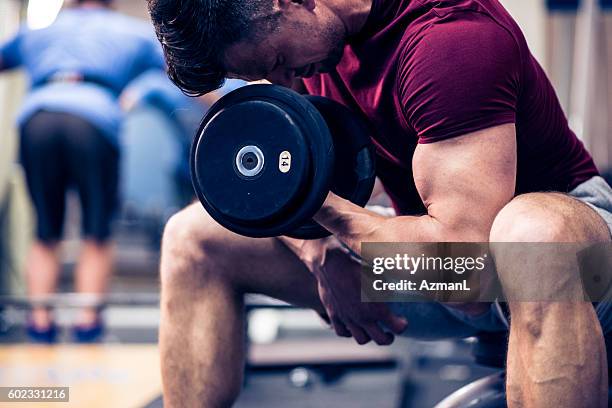 bulking up those muscles - arms of steel stock pictures, royalty-free photos & images