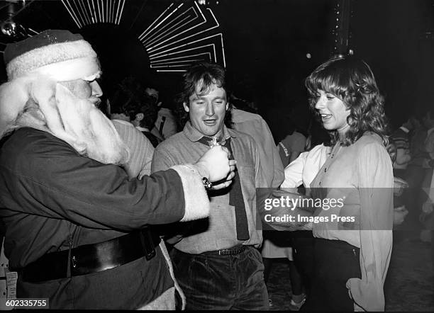 Robin Williams dancing with wife Valerie have some fun with Santa Claus at Studio 54 circa 1979 in New York City.