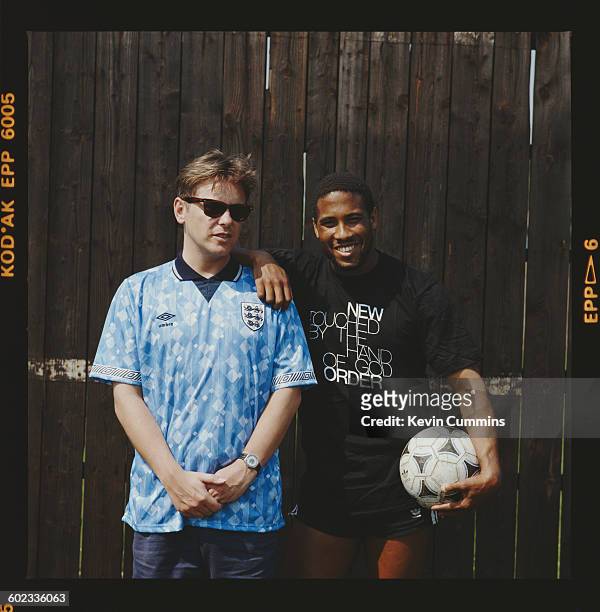 Singer Bernard Sumner , of English rock group New Order, with footballer John Barnes during the video shoot for the official song of the England...