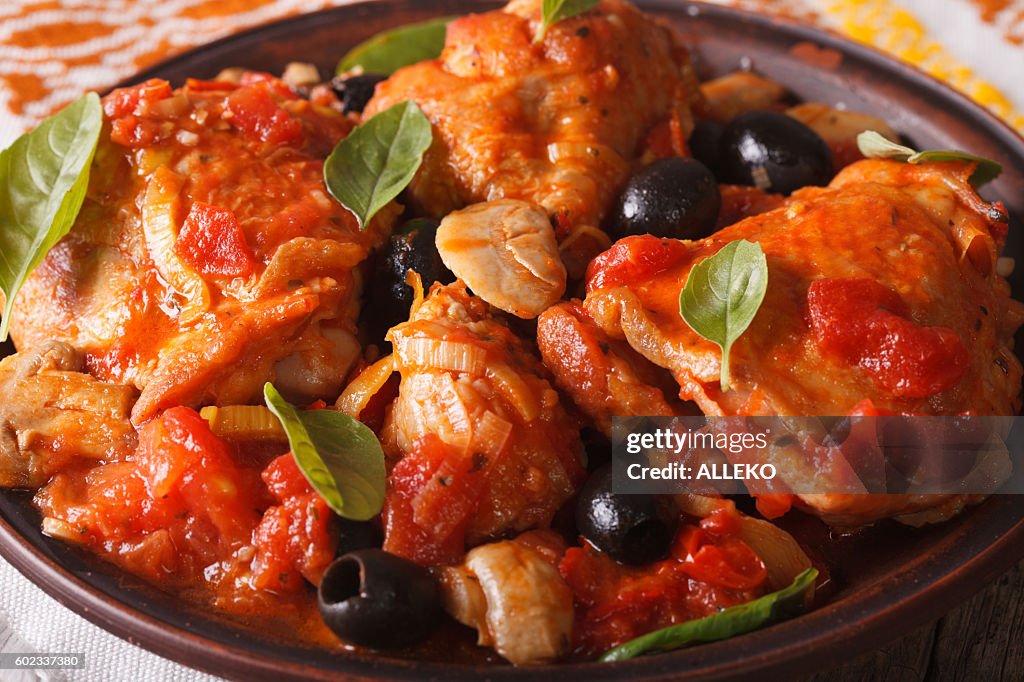 Italian food: Chicken Cacciatori on a plate close-up. horizontal