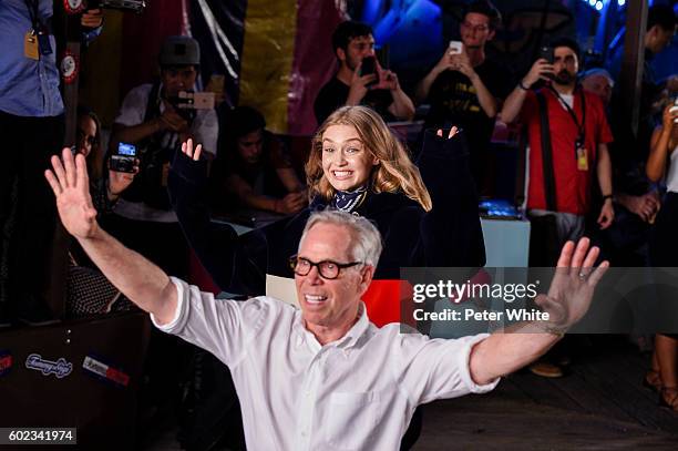 Designer Tommy Hilfiger and model Gigi Hadid walk the runway at Tommy Hilfiger Women's Fashion Show during New York Fashion Week at Pier 19 on...