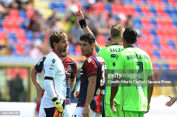 The Referee Abissso shows a red card to Marco Storari goalkeeper of Cagliari Calcio during the Serie a match between Bologna FC and Cagliari Calcio...