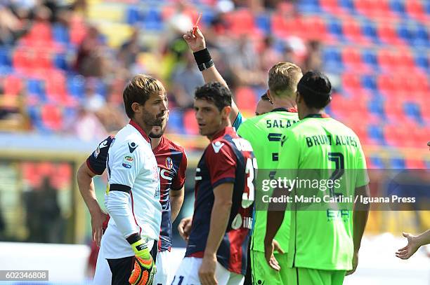 The Referee Abissso shows a red card to Marco Storari goalkeeper of Cagliari Calcio during the Serie a match between Bologna FC and Cagliari Calcio...