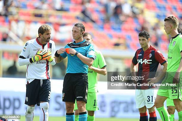 The Referee Abissso shows a red card to Marco Storari goalkeeper of Cagliari Calcio during the Serie a match between Bologna FC and Cagliari Calcio...