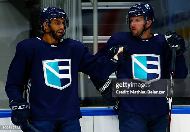 Pierre-Edouard Bellemare and Thomas Vanek of Team Europe speak together during a practice at the Centre Videotron on September 7, 2016 in Quebec...